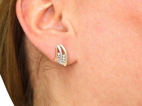 Wearing Gold Earrings