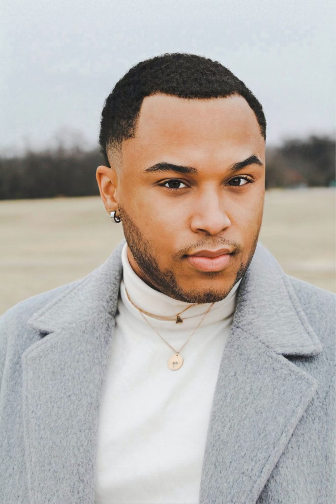 man wearing earrings