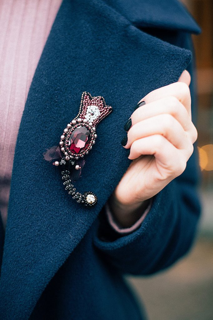wearing gemstone brooch