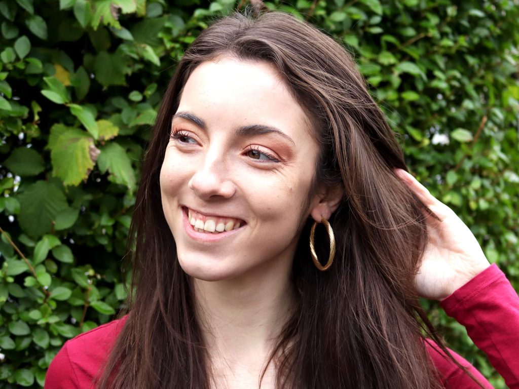 wearing medium sized hoop earrings 
