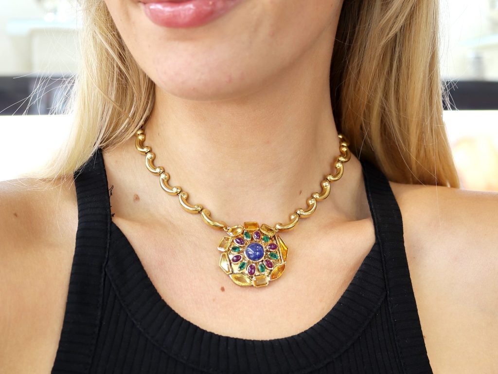 wearing sapphire and emerald 1940s pendant