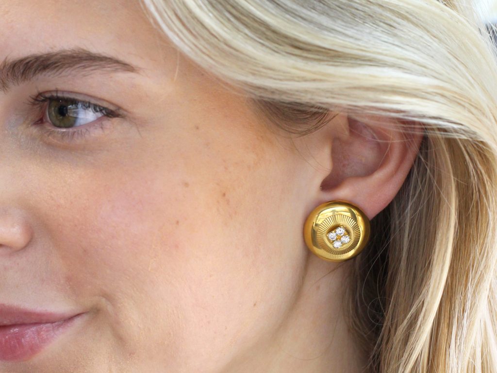wearing 1960s clip on earrings