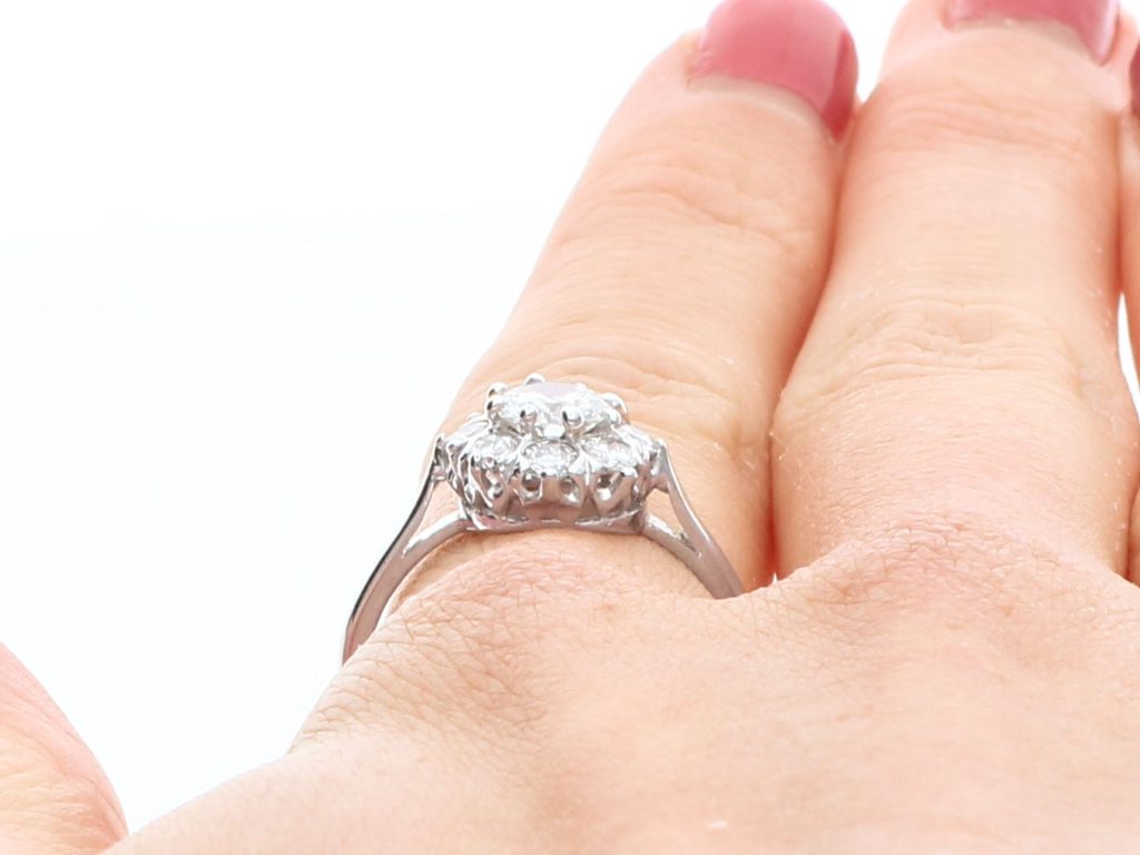 minimalist halo engagement ring on hand