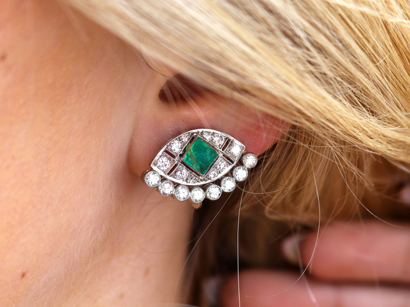 emerald and diamond Art Deco earring being worn