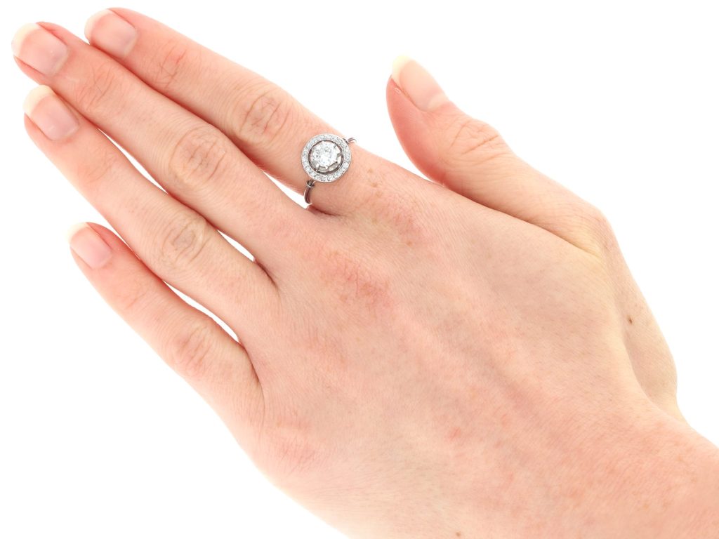 minimalist halo engagement ring on hand