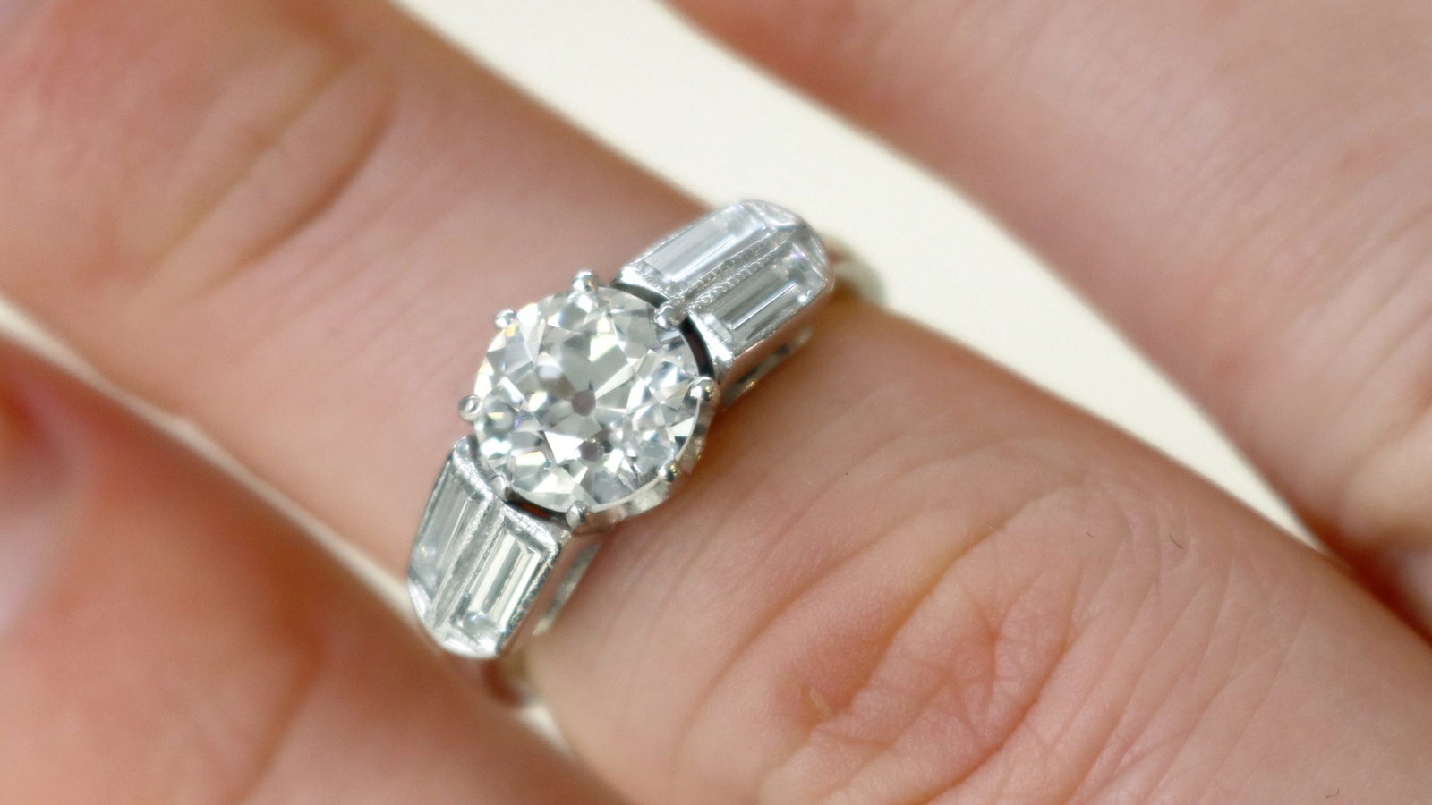 1930s engagement ring with contrasting round and baguette cut diamonds