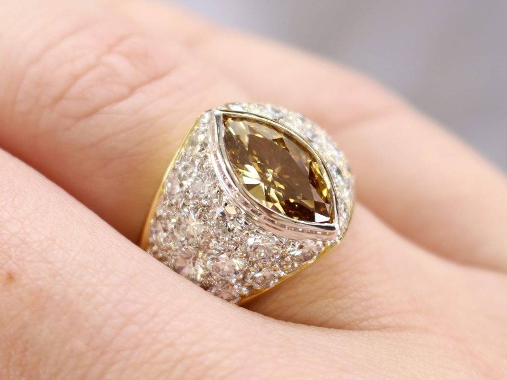 brown diamond ring on finger 