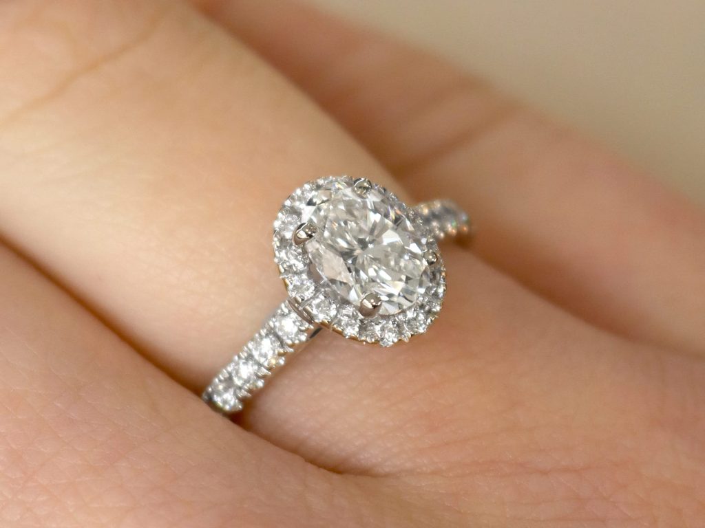 diamond halo ring on finger 