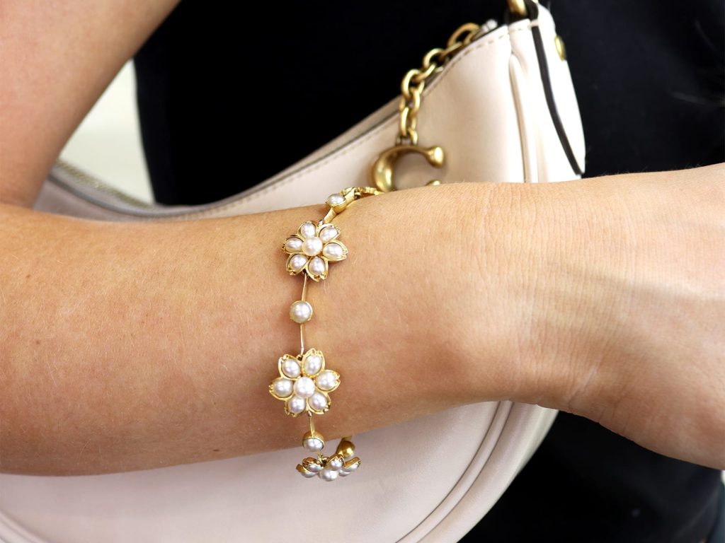 floral pearl bracelets on wrist 