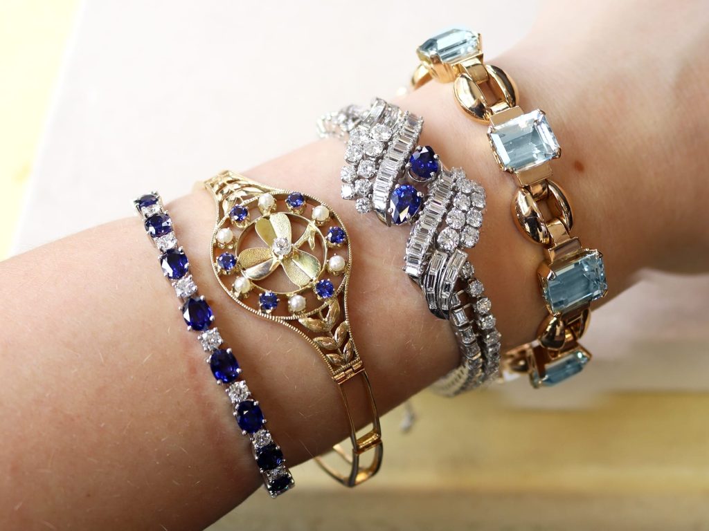 gemstone bracelets stacked on wrist 