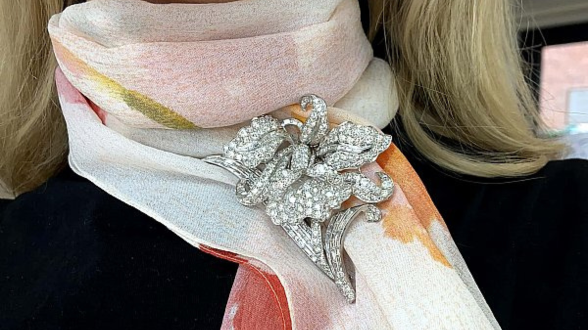 diamond flower brooch on scarf