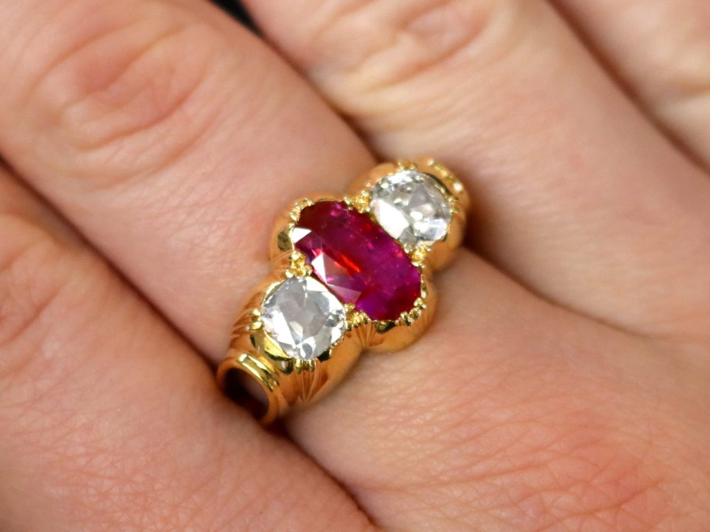 Victorian ruby and diamond trilogy ring on finger 