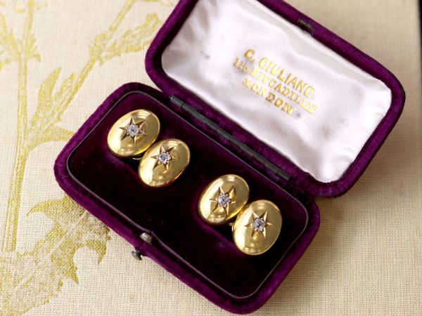 yellow golf cufflinks in box