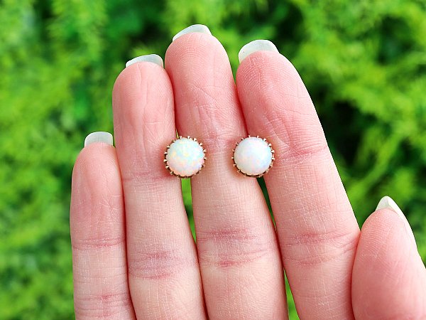 opal and yellow gold studs