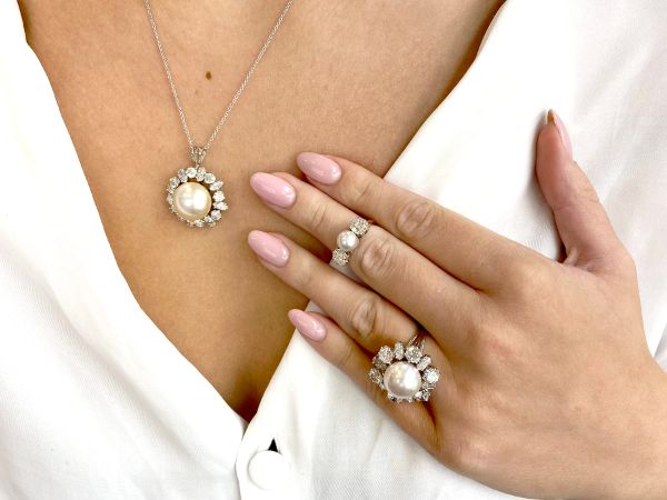 pearl necklace styled with matching rings 