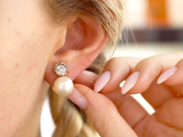 diamond and pearl earrings in ear